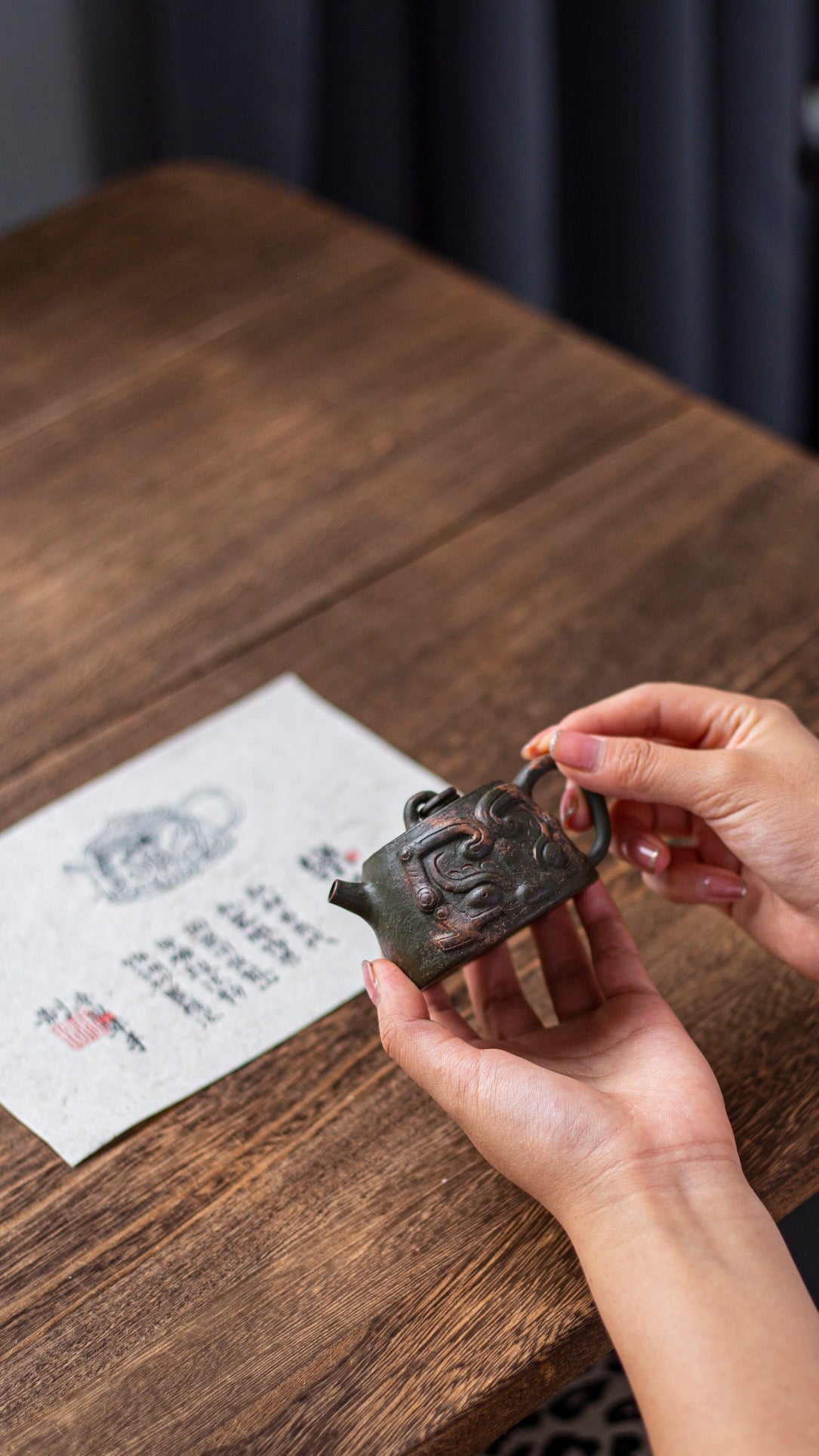 Sanxingdui jade-faced gluttonous beast pattern Qinquan purple clay teapot