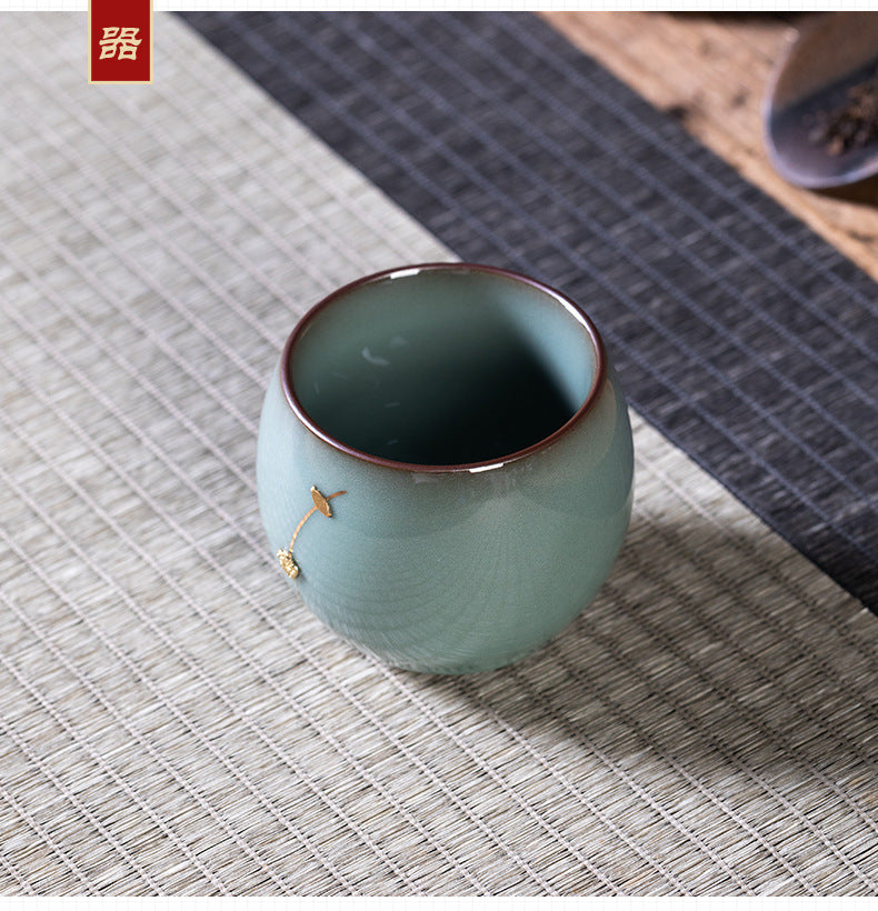 Longquan celadon iron body plum blossom handmade master cup ceramic tea single cup, kung fu tea set teacup