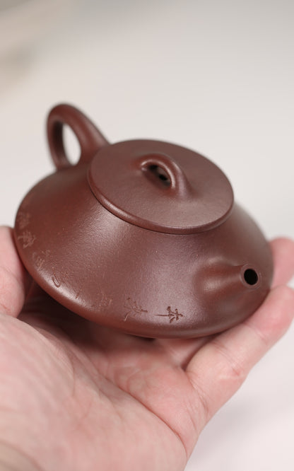 old purple clay teapot