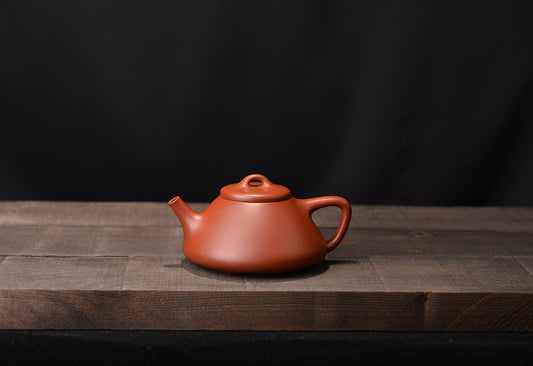 Zhuni Dahongpaozi smelting stone scoop and purple sand teapot