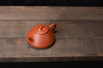 Zhuni Dahongpaozi smelting stone scoop and purple sand teapot