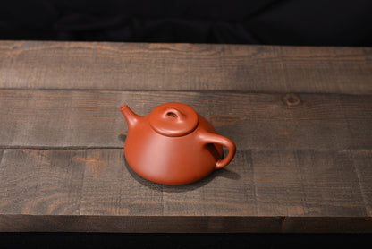 Zhuni Dahongpaozi smelting stone scoop and purple sand teapot