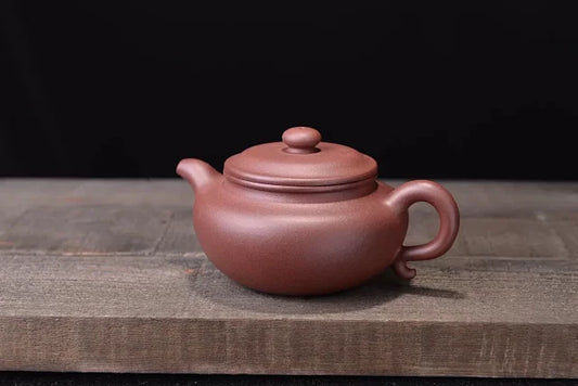 Antique purple clay pot